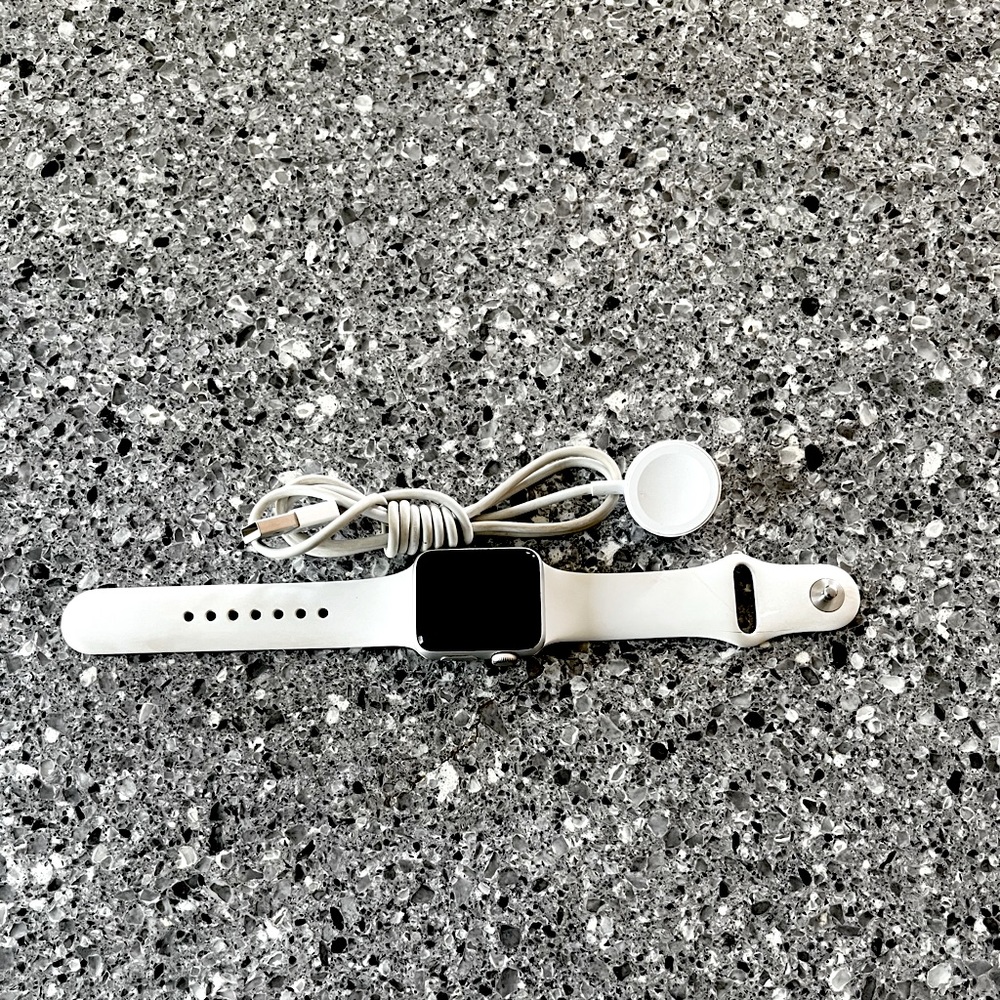 White series 3 Apple Watch with charger